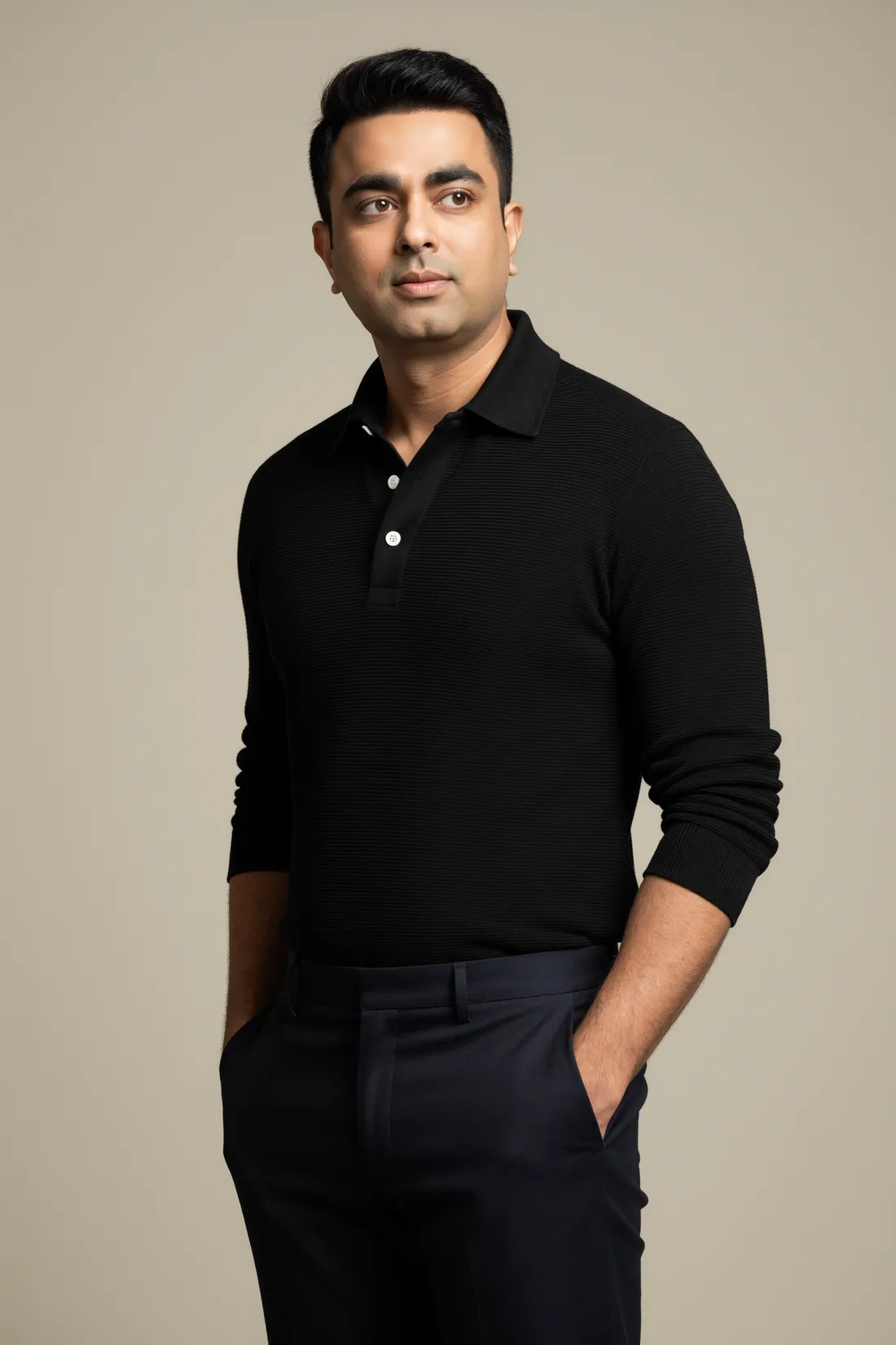 Vinay Trivedi, Indian crime fiction author, in a black polo looking to his left